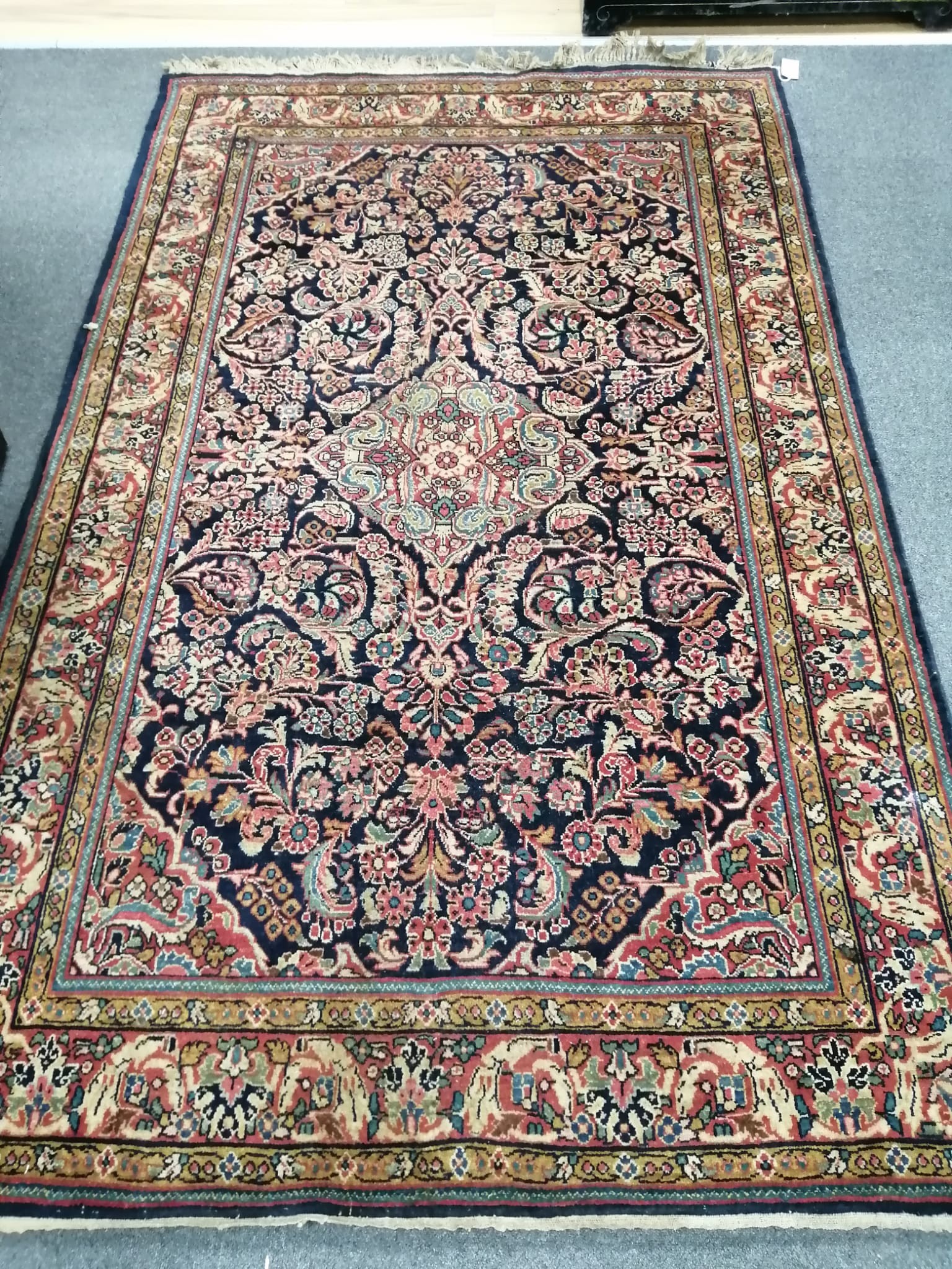 A Persian blue ground rug, probably Mashad, 210 x 131cm